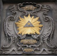 Масонский символ - всевидящее око в золотом ореоле